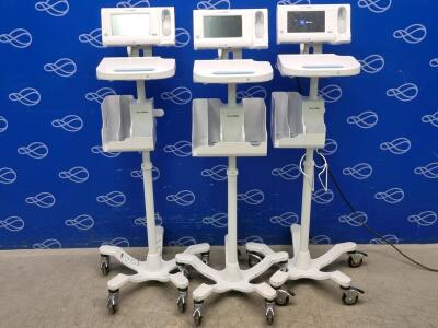 3 x x Welch Allyn 75ME Connex Monitor and Welch Allyn 7000-APM Accessory Power Management Unit on Rollstand