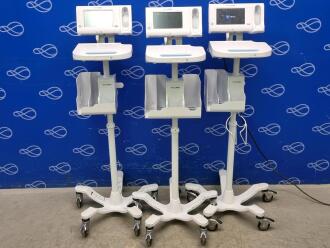3 x x Welch Allyn 75ME Connex Monitor and Welch Allyn 7000-APM Accessory Power Management Unit on Rollstand