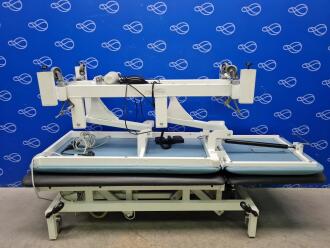 1 x Huntleigh Akron A2223/8/2HS and 1 x Metron Medical T6716 2-Section Electric Treatment Couch