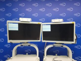 2 x Olympus Stack Trolleys with 2 x Olympus OEV262 Display Monitors and 1 x Olympus Evis Lucera Elite CLV-290SL Light Source - 2